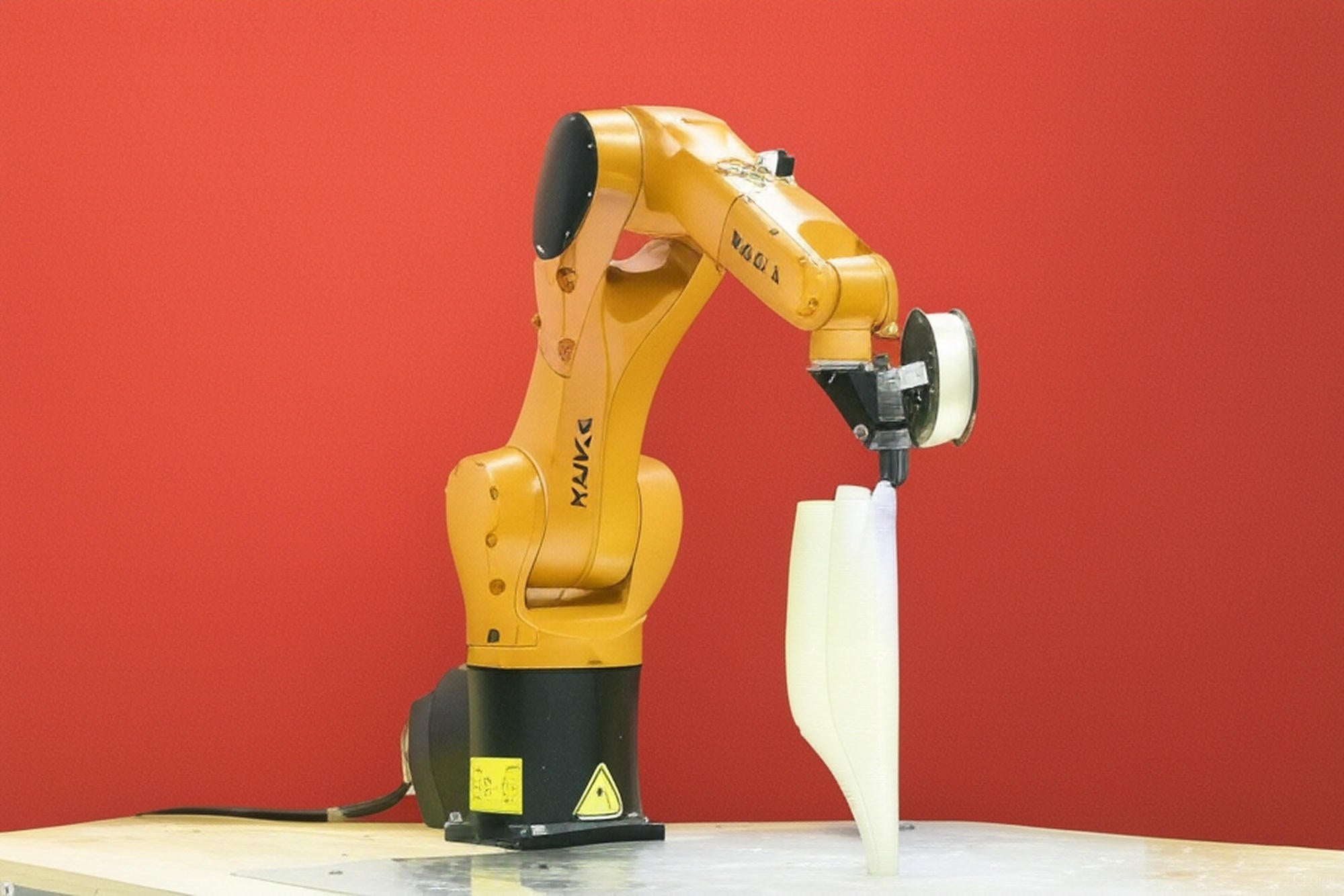 Advanced 3D printing with robotics showing multi-angle precision and curved structures
