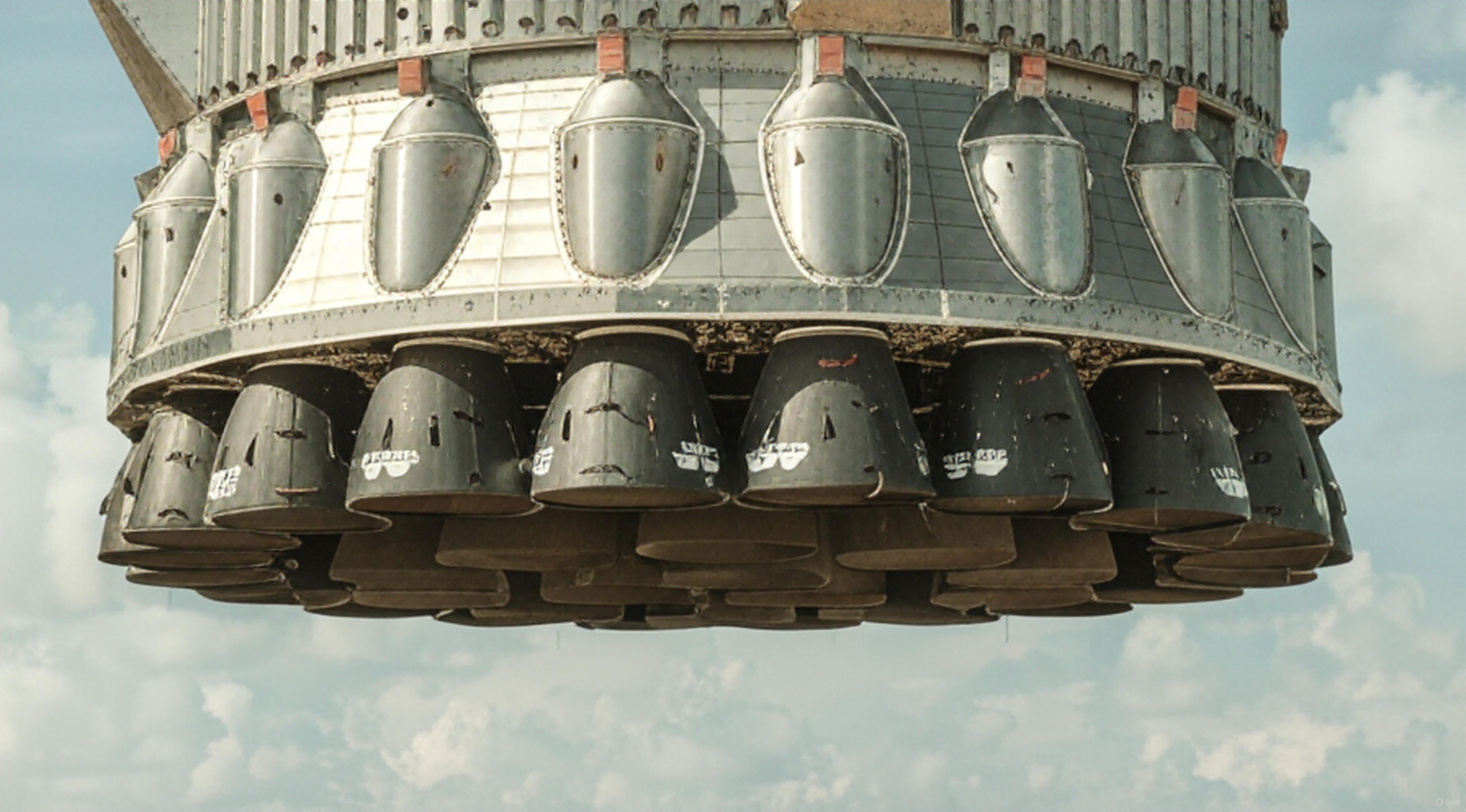 Flight-proven Super Heavy rocket at Starbase Texas with Tesla Cybertruck escort